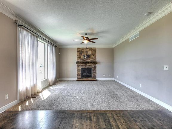 Great room features stone fireplace