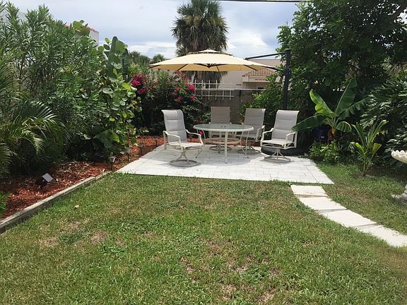 Backyard Dining Patio with Lighted Umbrella 