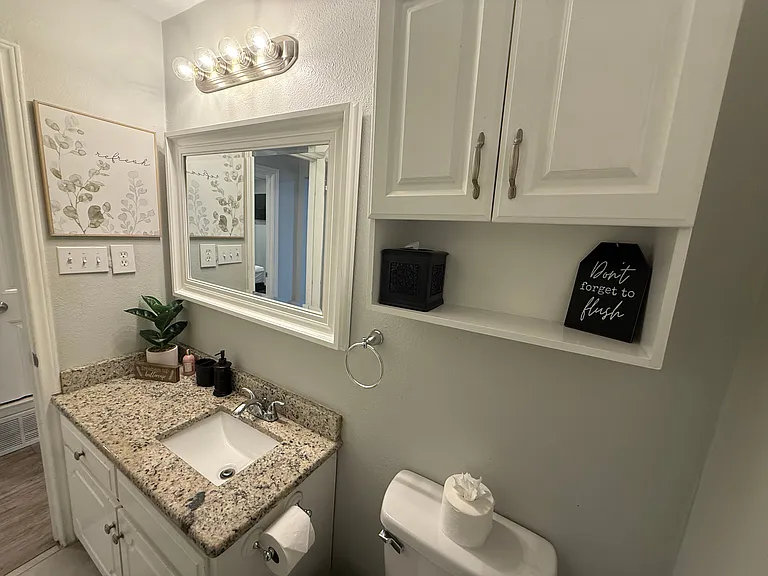 Full Bathroom 1 - walk-in shower and bathroom essentials.