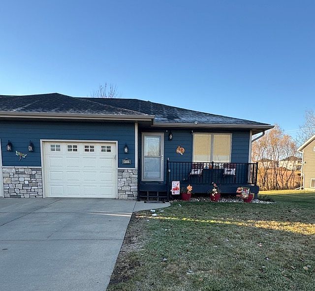 Front-Twin home with single car garage.