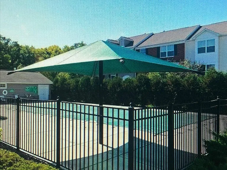 Outdoor community pool in complex
