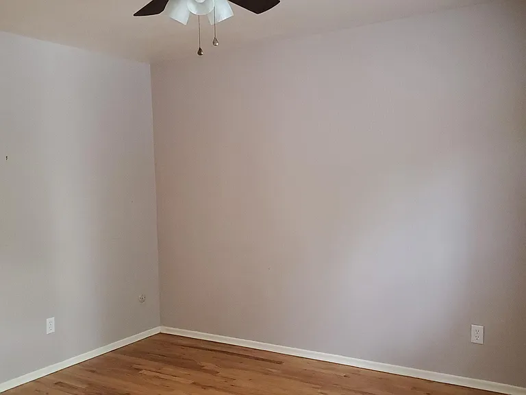 Another view of master bedroom. The pictured hardwood floor has just been replaced with new luxury vinyl flooring.
