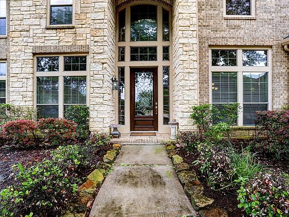Enter the home through the 9 foot leaded glass 2 story entry with double transom windows over the front door.