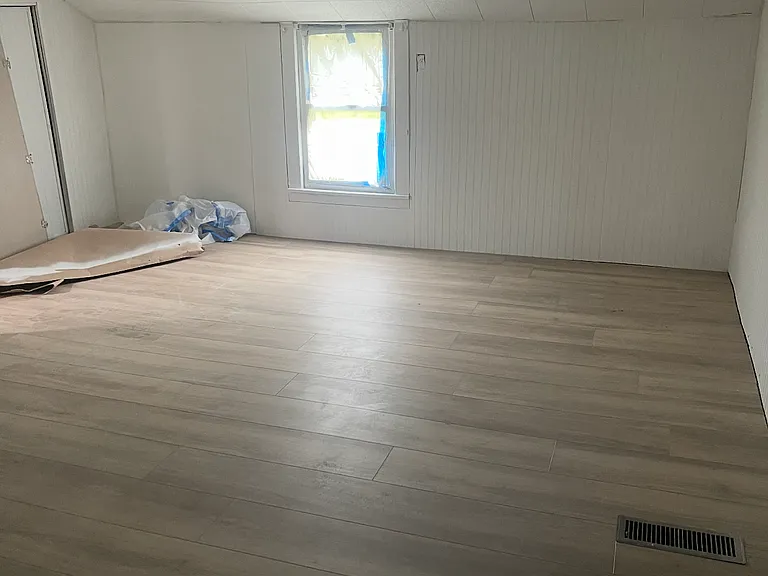 Master bedroom downstairs with 2nd small closet
