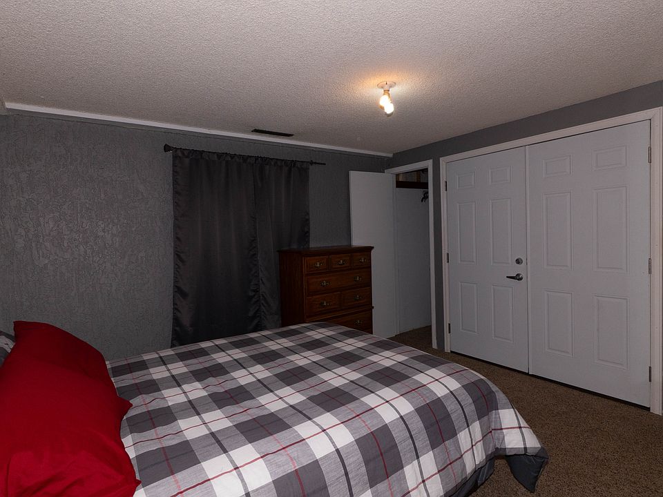 Bedroom includes a queen sized bed, dresser, mirror, side table. There is a small closet here, with additional closet space in the bonus room.