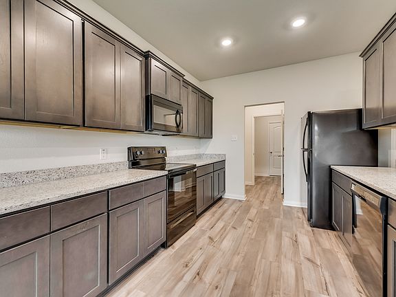 The kitchen comes with a full suite of energy-efficient appliances.