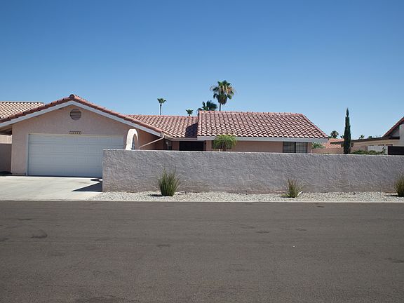 This two car garage home sits in a quiet safe neighborhood. The yard is completely enclosed for privacy. An arched gate leads to the courtyard.