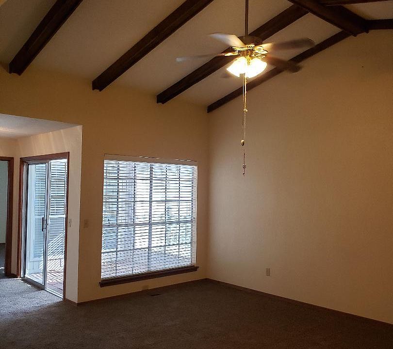 Living Room with Beams and Fan