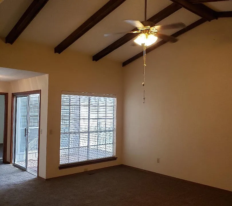 Living Room with Beams and Fan