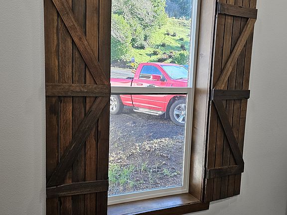 Hand-made shutters from reclaimed lumber.