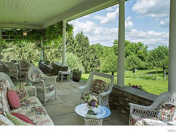 Gracious terrace with blue stone, viewing the orchards & landscaping