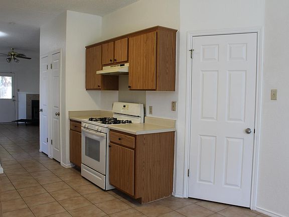 Other angle of the kitchen area with entrance to the garage and laundry room