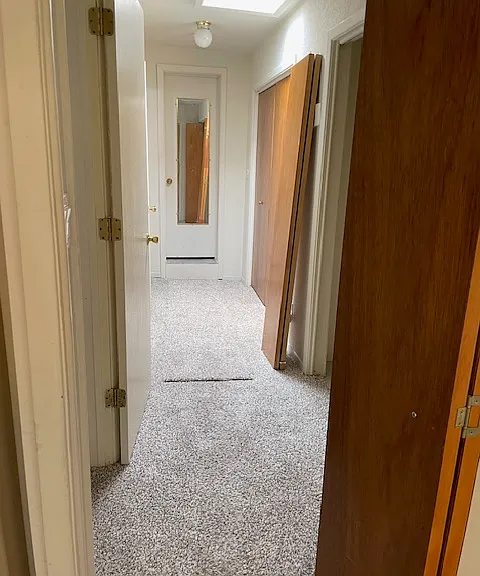 back hallway with 2 6.5' closets