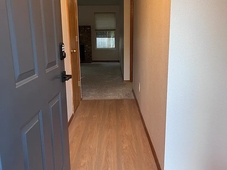 Welcome! Hallway entry - Bedroom #3 to the right, rest of the house straight ahead. Hall closet on left.