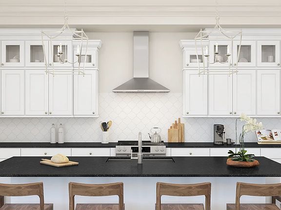 Kitchen with glass upper cabinets and pendant lighting