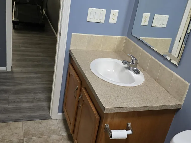 2nd bathroom w/view of entry to 3rd bedroom