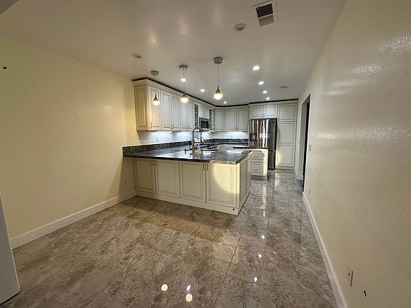 Kitchen with nook and breakfast bar