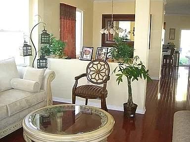 Entryway, living room, and dining room when it was furnished. (Rental is unfurnished)