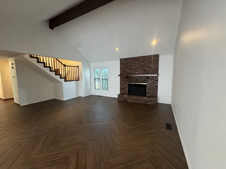 Spacious, Vaulted, and beamed Living room looking east
