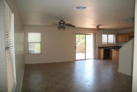 Living rooms leads out to patio and backyard
