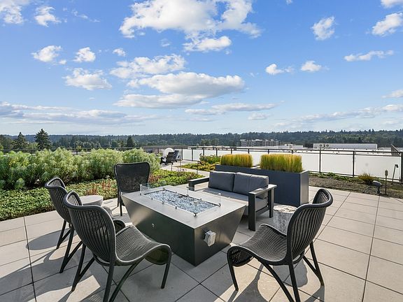 Unwind above it all in the serene rooftop lounge.