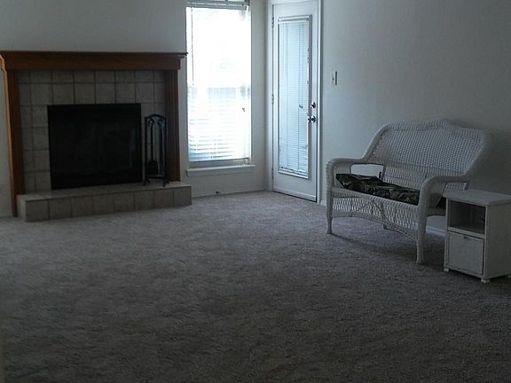 Vaulted main living area with access to pergola covered patio