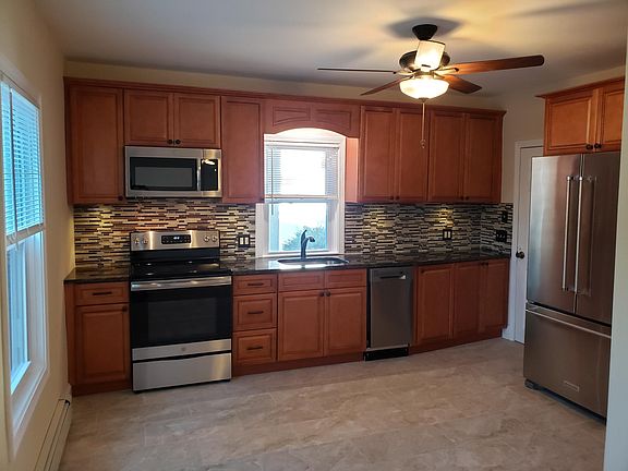 Kitchen looking from living area. Window over sink looks out into large back yard