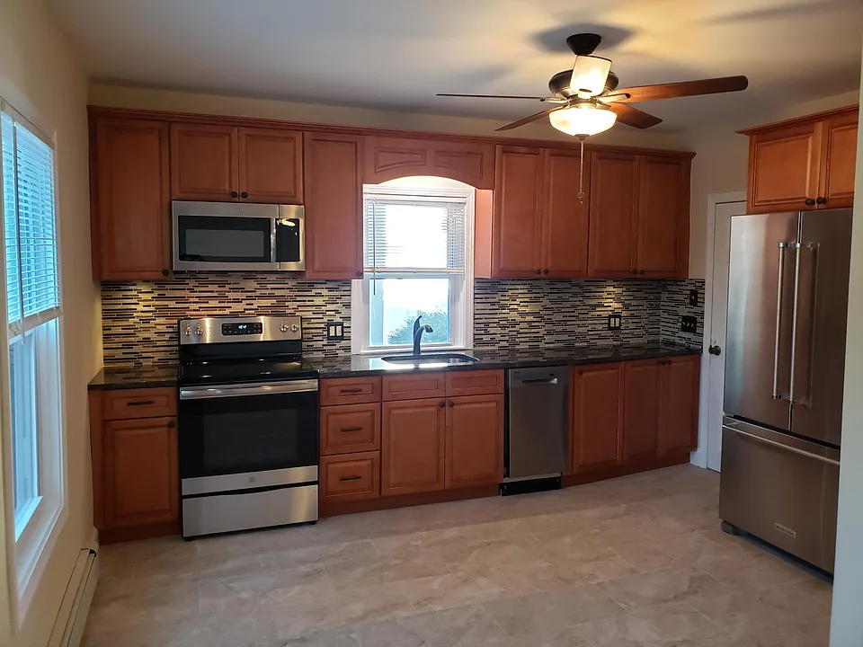 Kitchen looking from living area. Window over sink looks out into large back yard