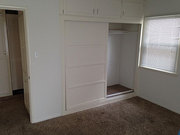 Bedroom with lots of closet space 
Hall has a linen and coat