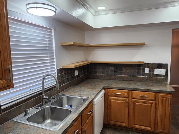Modern open shelve concept in the kitchen and led lighting.