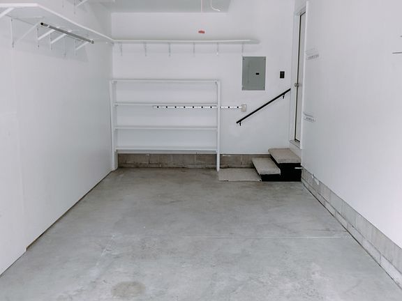 3 Step Entry from Garage in rear where parking is (No other steps inside unit). Keyless & remote garage door entry. All locks & deadbolts keyed alike.
