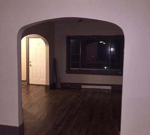 Living room, new flooring & 1st floor laundry off to the sid