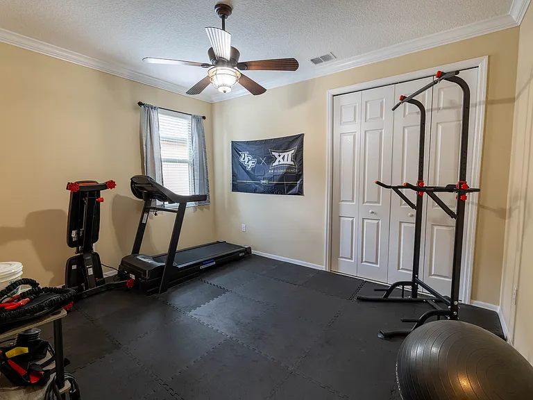 Guest Bedroom with Closet and Access to Jack and Jill Bathroom; Currently Being Used as a Gym.