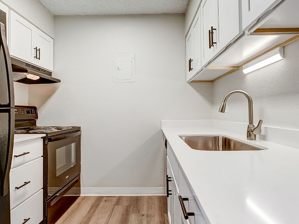 Sleek quartz countertops and stainless steel appliances