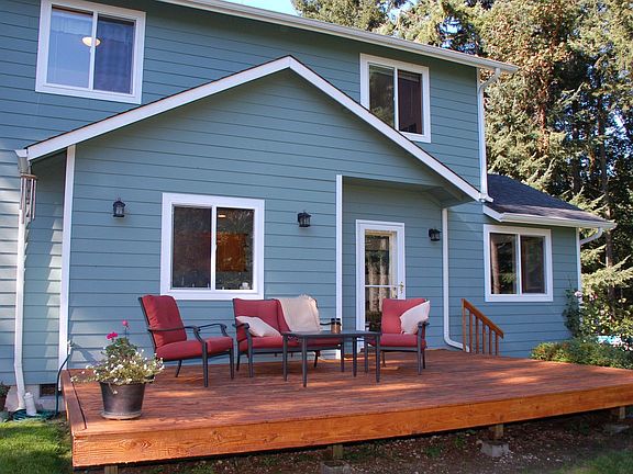 The massive deck and large back yard offers room for many outdoor spaces.