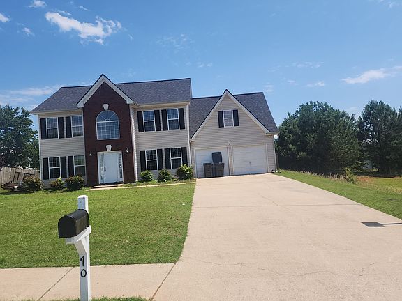 Freshly washed driveway and beautiful Grass.