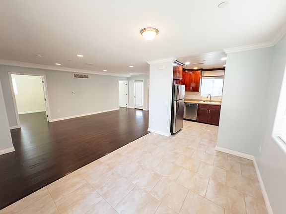 Living room, dining area and kitchen