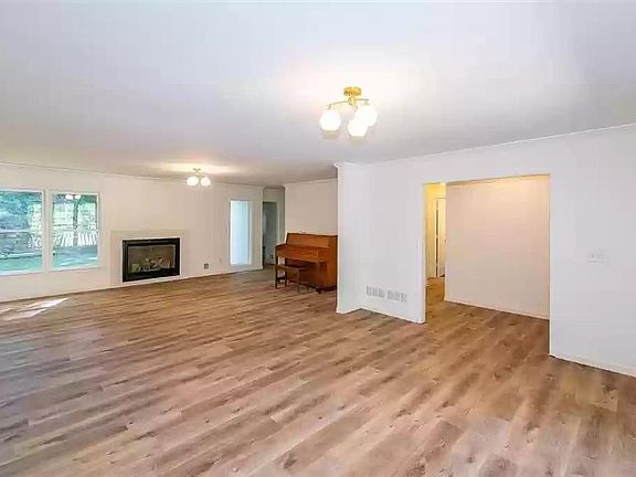 Living Room with Fire place baby piano