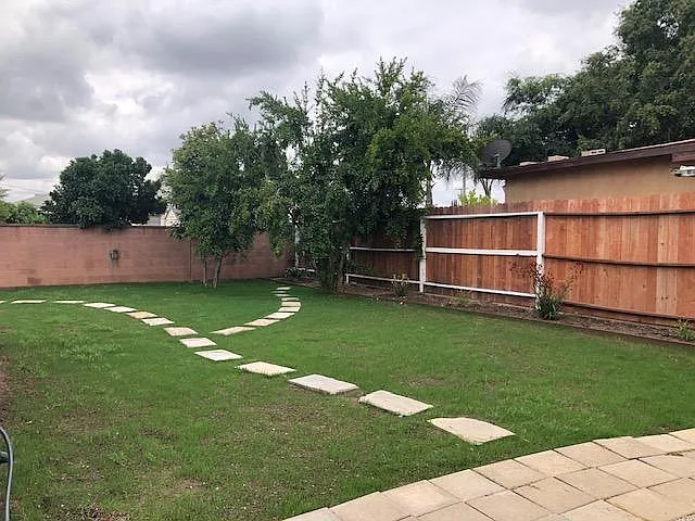Large Backyard with new grass and auto sprinklers