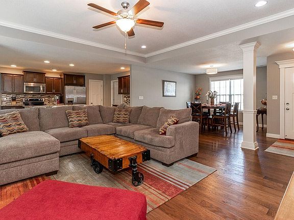 living room view to dining and kitchen