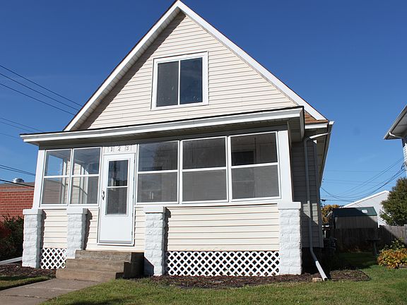 Front of home with nice yard