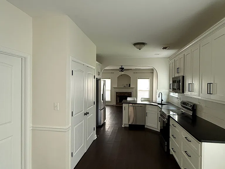 View from backdoor- laundry behind double doors
