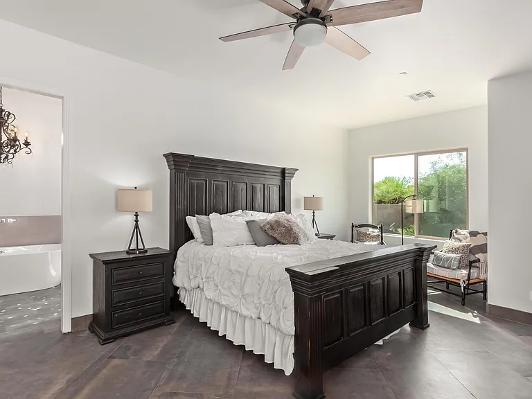 MAIN OR MASTER BEDROOM, KING BED, TWO NIGHTSTANDS, DRESSER AND TV, TWO CHAIRS.