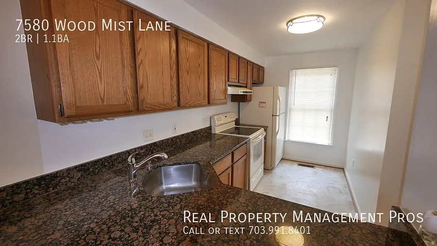 Bright and spacious two-level townhome pairs comfort with an unbeatable location. — Photo 3
