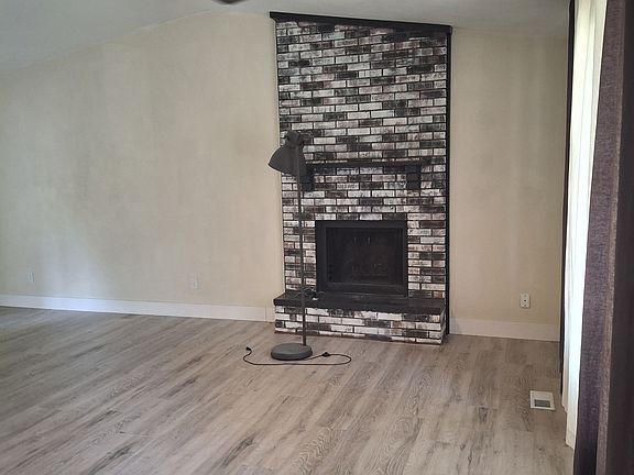 Living Room 
Woo Burning Fire Place