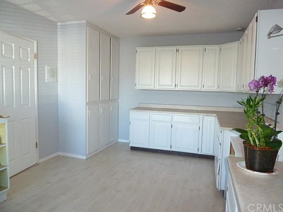 Den near front entry set up as a hobby or work room, easily converted