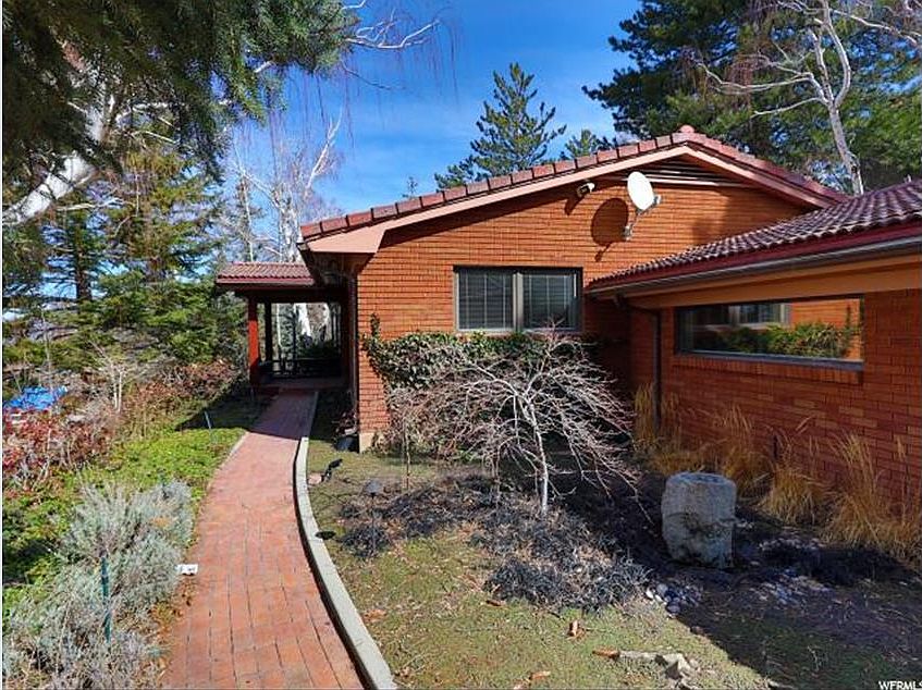 Walkway from driveway to front entrance --two car garage on right