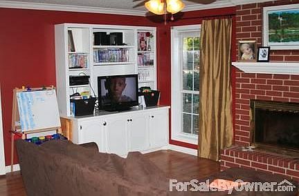 Living area - great for playroom/study : updated ceiling fan, gas fireplace, brand new door
