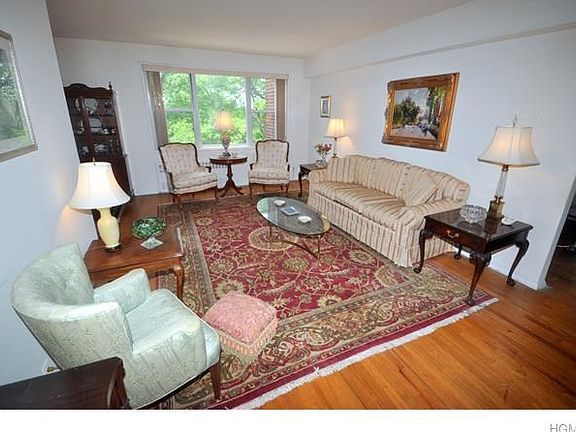 Living room opens to the entry foyer and "L" shape dining room.
