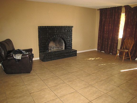 Den, tile floor, ceiling fans
